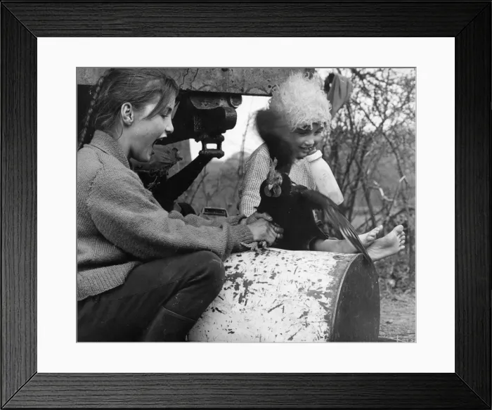 Framed Print : Two gipsy girls with a chicken