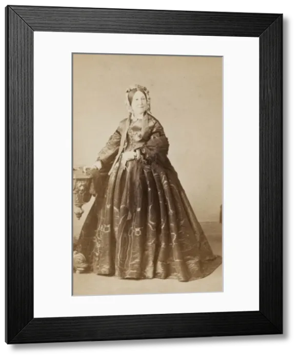Framed Print : Middle-aged Victorian woman in a crinoline dress Framed Print : Middle-aged Victorian woman in a crinoline dress