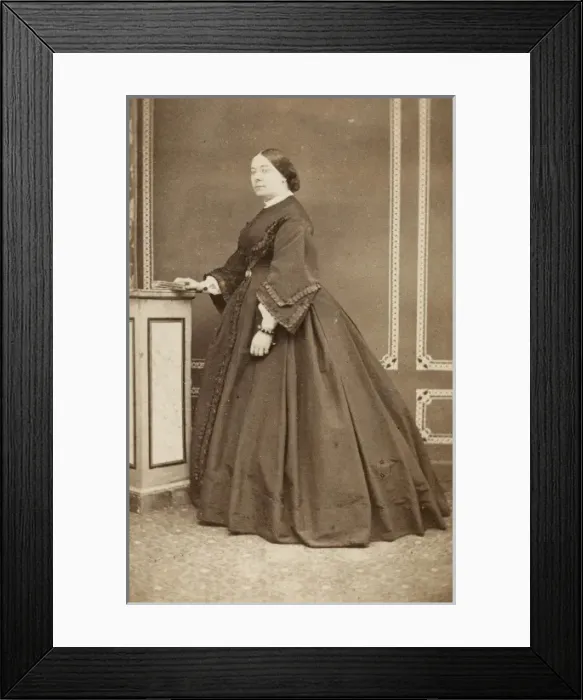 Framed Print : Victorian woman in a dark crinoline dress Framed Print : Victorian woman in a dark crinoline dress