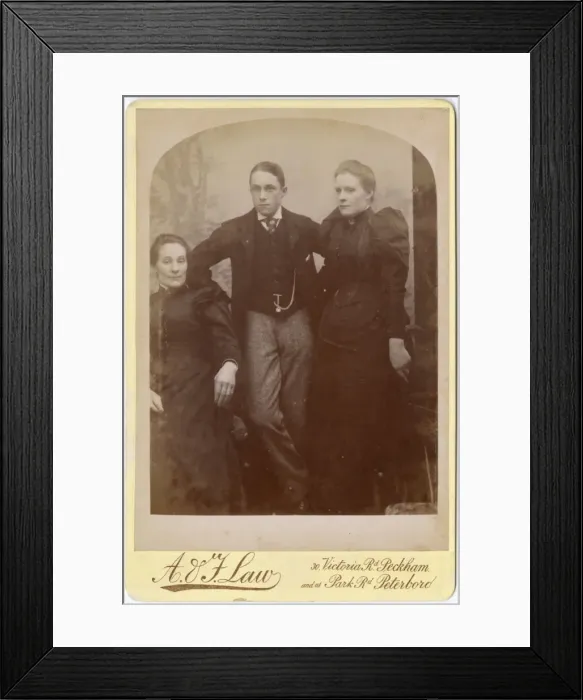 Framed Print : Two Victorian sisters and their brother in studio setting Framed Print : Two Victorian sisters and their brother in studio setting