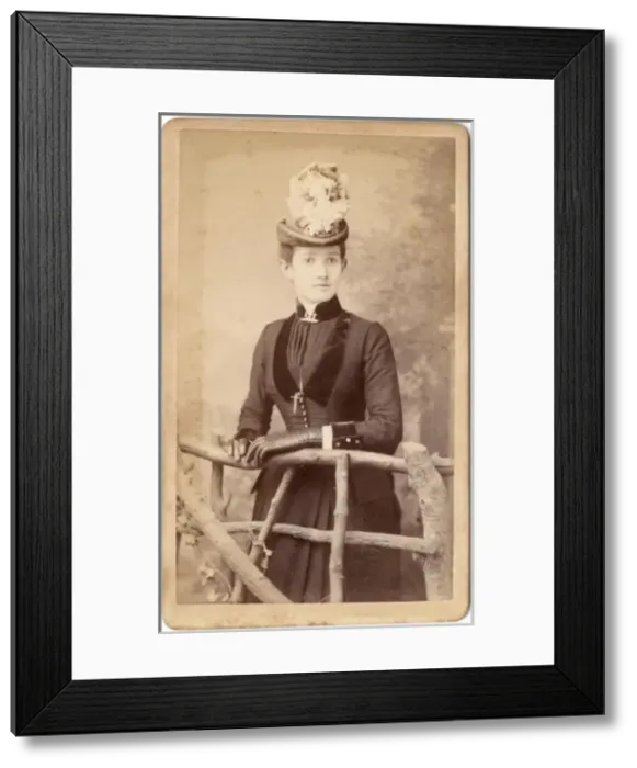 Framed Print : Victorian woman standing behind a rustic fence Framed Print : Victorian woman standing behind a rustic fence