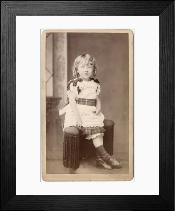 Framed Print : Little Victorian girl in lacy dress with tartan trimmings Framed Print : Little Victorian girl in lacy dress with tartan trimmings