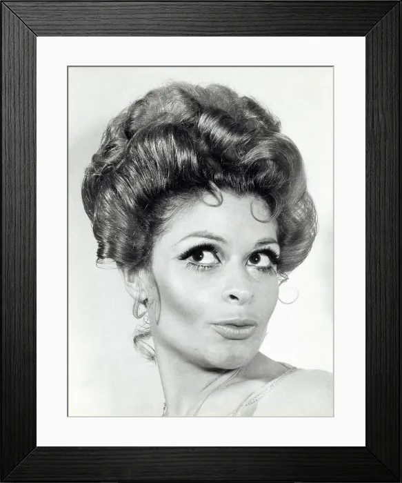 Framed Print : A model with hair coiffured with an elaborate curl effect Framed Print : A model with hair coiffured with an elaborate curl effect