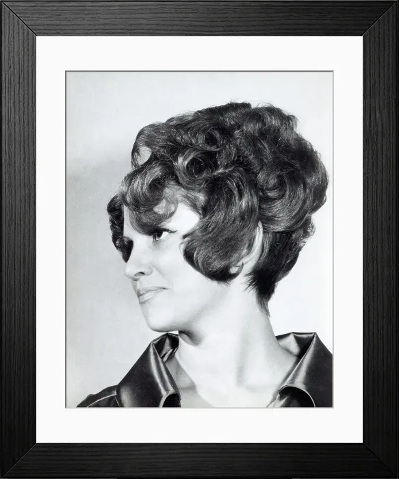 Framed Print : A model with hair coiffured with an elaborate curl effect Framed Print : A model with hair coiffured with an elaborate curl effect
