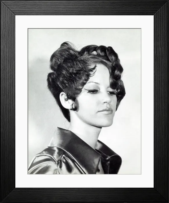 Framed Print : A model with hair coiffured with an elaborate curl effect Framed Print : A model with hair coiffured with an elaborate curl effect