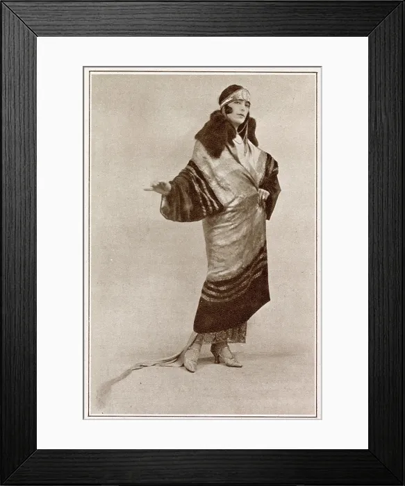 Framed Print : Evening cloak in silver tissue and black velvet with fur collar, by Magame Lairoix. Date: 1923 Framed Print : Evening cloak in silver tissue and black velvet with fur collar, by Magame Lairoix. Date: 1923