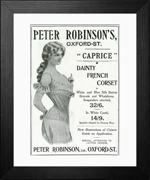Framed Print : Woman wearing a dainty French corset with white and blue silk batiste, brocade and whalebone, suspenders attached. Date: 1902 Framed Print : Woman wearing a dainty French corset with white and blue silk batiste, brocade and whalebone, suspenders attached. Date: 1902