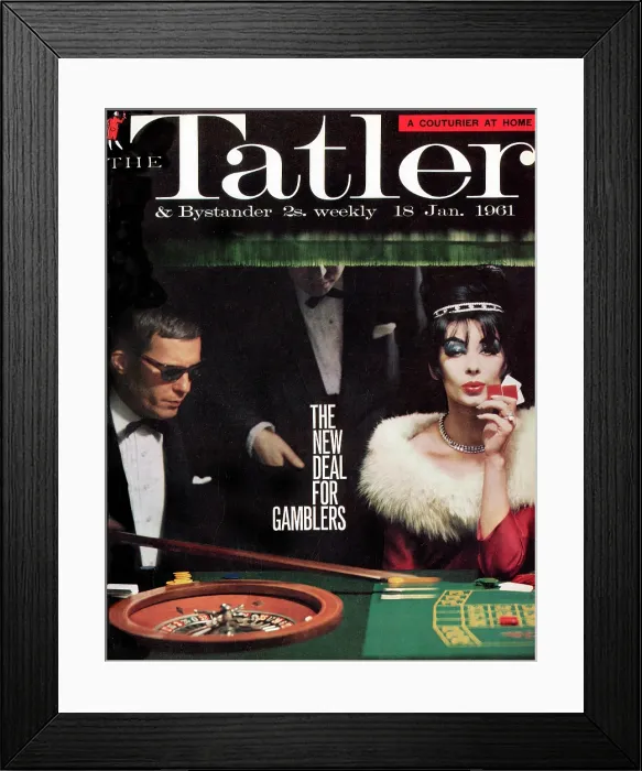 Framed Print : Tatler Front Cover - A man in a suit and sunglasses, and a black-haired woman in a red dress with a white fur collar are sitting at a roulette table Framed Print : Tatler Front Cover - A man in a suit and sunglasses, and a black-haired woman in a red dress with a white fur collar are sitting at a roulette table