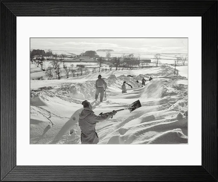 Framed Print : John (at front) clearing the snow in Yorkshire as part of the community work that is done by Polish Forces staying at the Helmsley Polish Resettlement Camp Date: 1947 - 1948 Framed Print : John (at front) clearing the snow in Yorkshire as part of the community work that is done by Polish Forces staying at the Helmsley Polish Resettlement Camp Date: 1947 - 1948