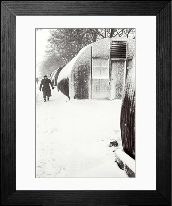Framed Print : Polish soldier walking outside Nissen Hut covered in snow, Helmsley Resettlement Camp, Yorkshire Date: 1947 - 1948 Framed Print : Polish soldier walking outside Nissen Hut covered in snow, Helmsley Resettlement Camp, Yorkshire Date: 1947 - 1948