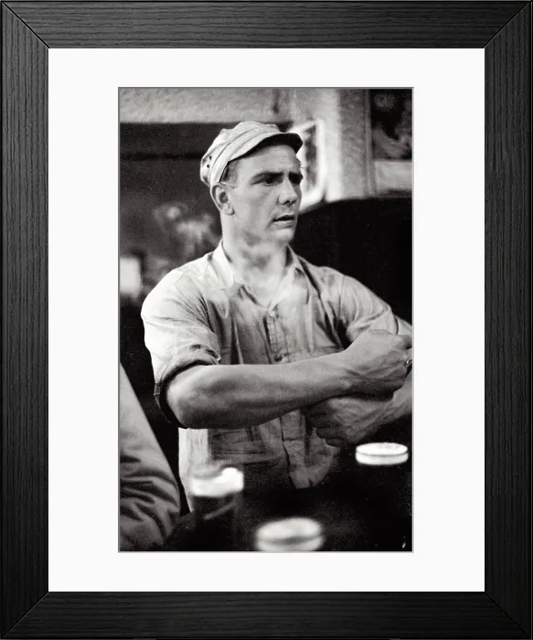 Framed Print : Young man in bar with cap listening to small band playing in daylight at local bar at Cafe In de Ton de Koninck in Katten Straat Antwerp Date: circa 1951 Framed Print : Young man in bar with cap listening to small band playing in daylight at local bar at Cafe In de Ton de Koninck in Katten Straat Antwerp Date: circa 1951