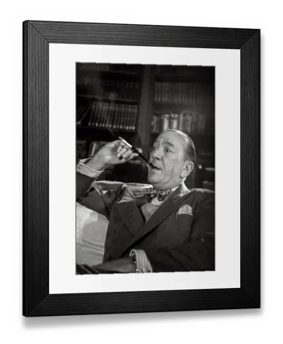 Framed Print : Noel Coward sits with cigarette in holder during rehearsal of Relative Values which opened at The Savoy Theatre in November 1951 Date: 1951 Framed Print : Noel Coward sits with cigarette in holder during rehearsal of Relative Values which opened at The Savoy Theatre in November 1951 Date: 1951
