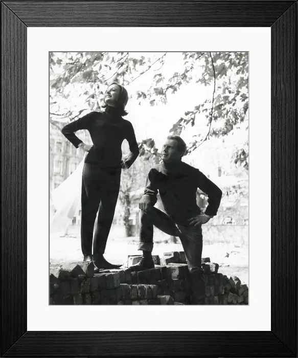 Framed Print : A couple pose on a pile of bricks. The woman holds a rather large hanky. Date: late 1960s Framed Print : A couple pose on a pile of bricks. The woman holds a rather large hanky. Date: late 1960s