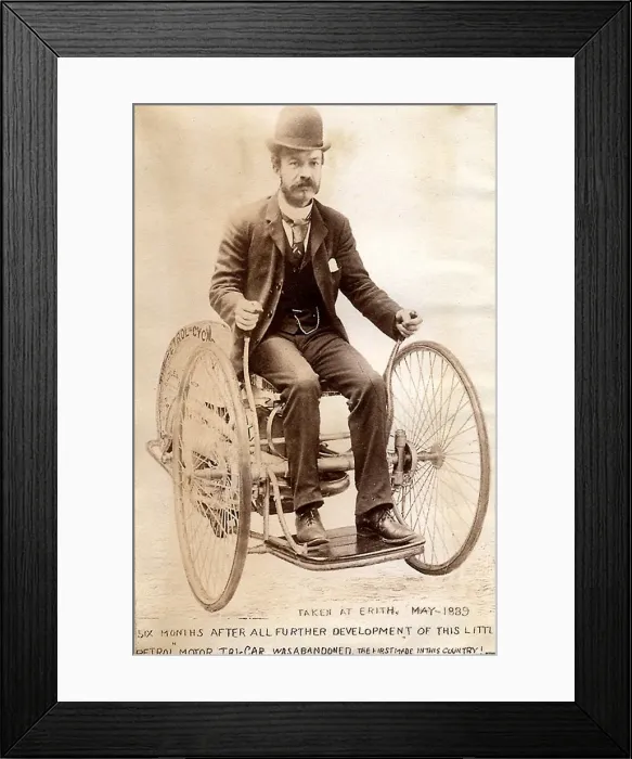 : Edward Butler steering his petrol Tri-car : Edward Butler steering his petrol Tri-car
