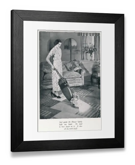 Framed Print : Woman hoovering Framed Print : Woman hoovering