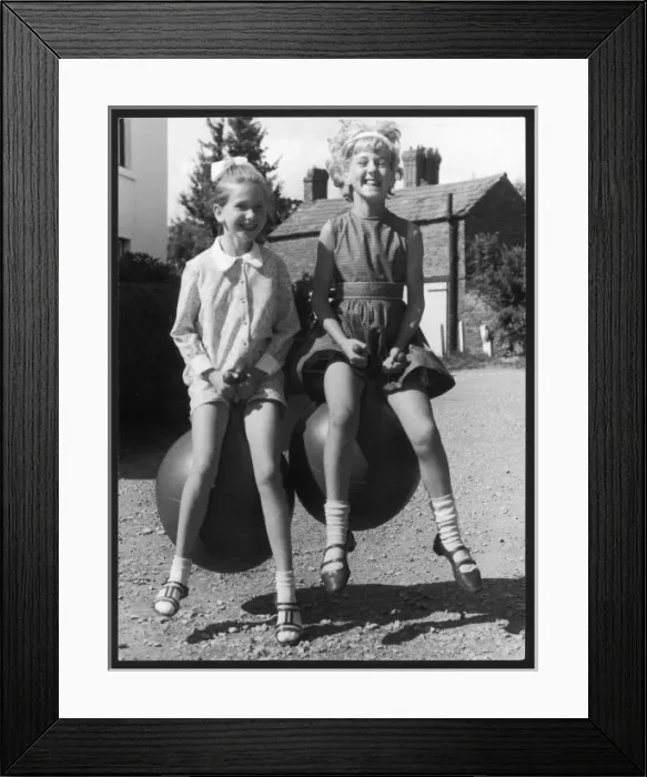 Framed Print : Girls on Spacehoppers Framed Print : Girls on Spacehoppers