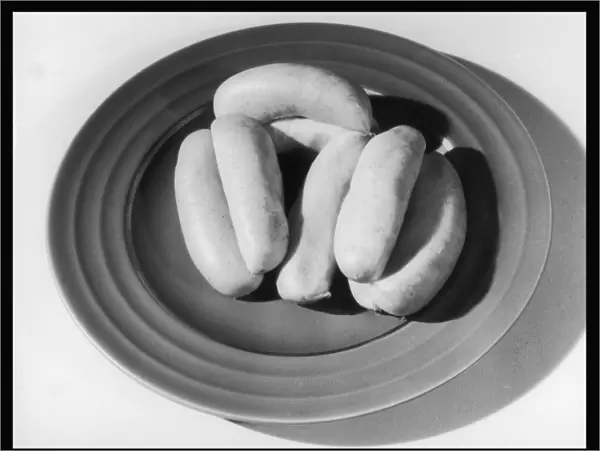 Raw Sausages on a Plate