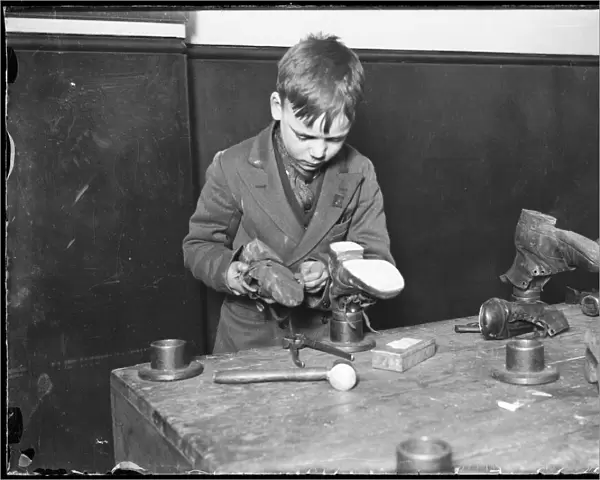 Boy Repairs Boots  /  1930