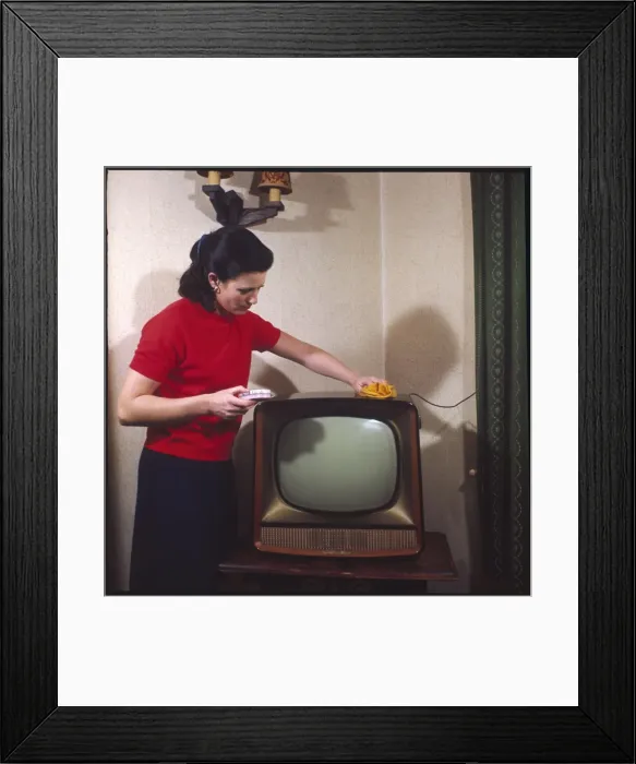 Framed Print : Dusting a Television Framed Print : Dusting a Television