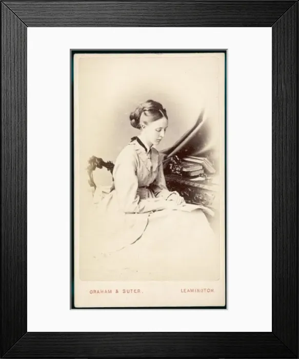 Framed Print : Reading with Book on Lap Framed Print : Reading with Book on Lap