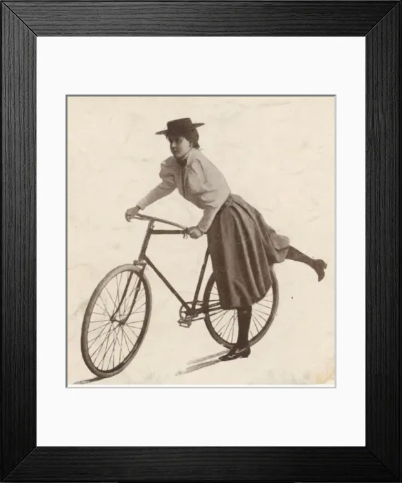 Framed Print : Girl Mounts her Bike Framed Print : Girl Mounts her Bike
