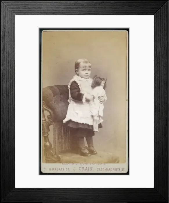 Framed Print : Girl with her Doll / Photo Framed Print : Girl with her Doll / Photo