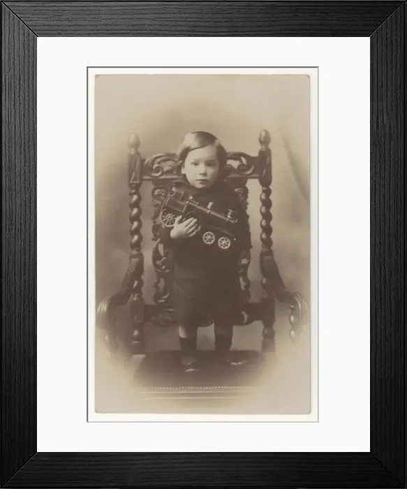 Framed Print : Boy Holding Toy Engine Framed Print : Boy Holding Toy Engine