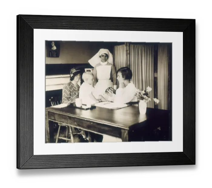 Framed Print : Doctor Examines Baby Framed Print : Doctor Examines Baby