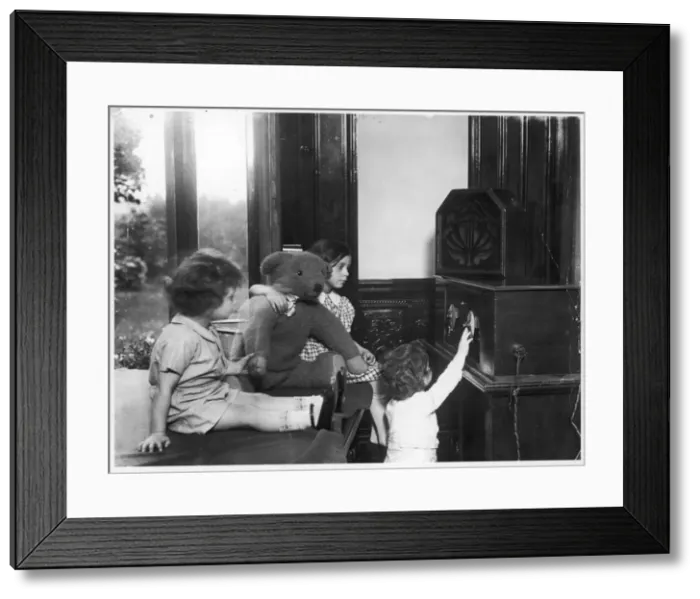 Framed Print : Children Listen to Radio Framed Print : Children Listen to Radio