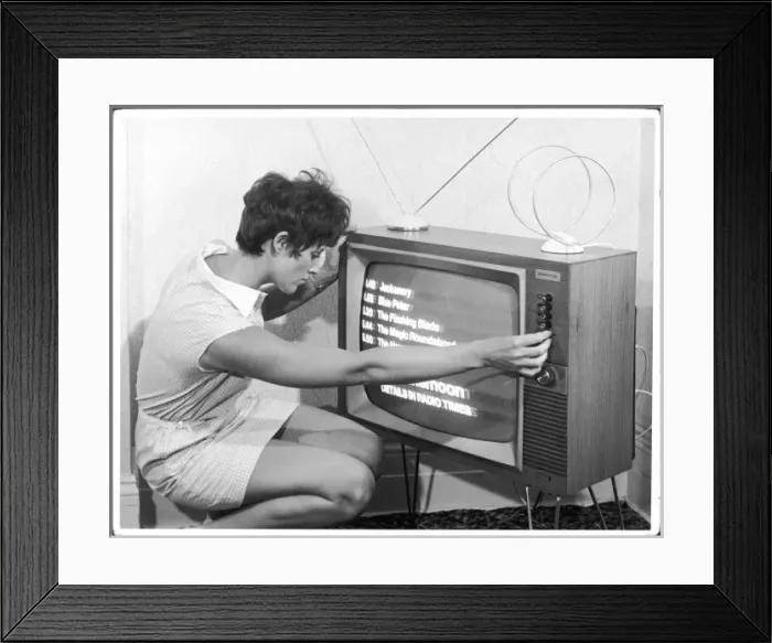 Framed Print : Adjusting a TV Set Framed Print : Adjusting a TV Set