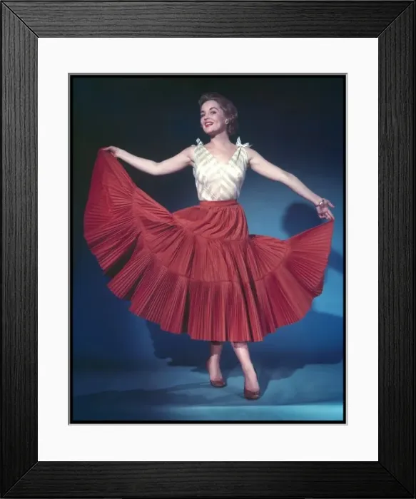 Framed Print : RED SKIRT. She holds out her red full circle skirt Framed Print : RED SKIRT. She holds out her red full circle skirt