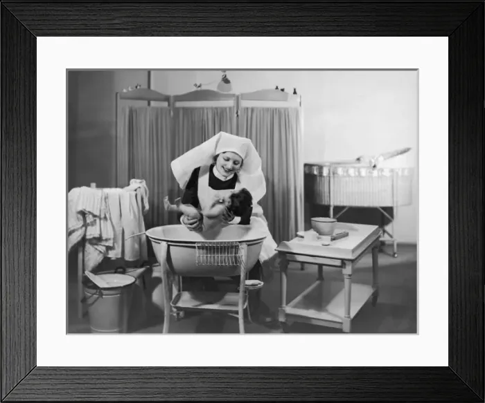 Framed Print : Nurse Bathes Baby / 1933 Framed Print : Nurse Bathes Baby / 1933
