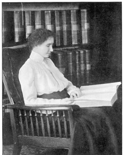 Helen Keller reading Braille