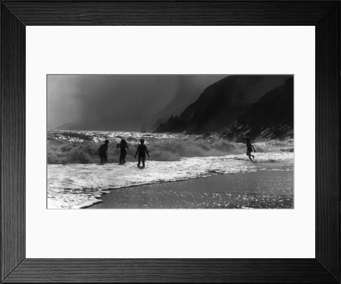 Framed Print : Children Play in Waves