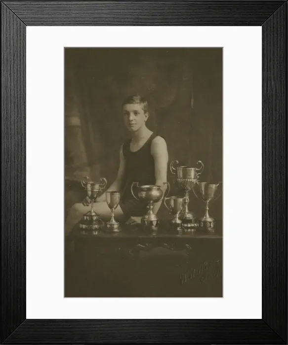 Framed Print : Fourteen year old swimming champion with trophies Framed Print : Fourteen year old swimming champion with trophies