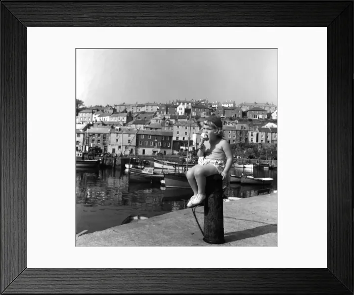 Framed Print : Little girl eating an ice cream, Cornwall Framed Print : Little girl eating an ice cream, Cornwall