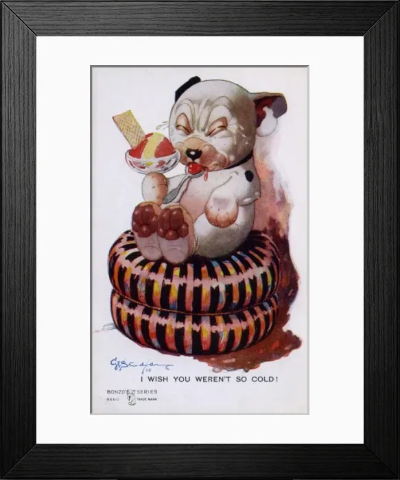 Framed Print : Bonzo on a cushion eating ice-cream Framed Print : Bonzo on a cushion eating ice-cream