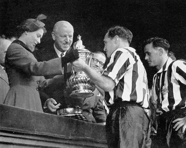 The Queen presents the F. A. Cup to Newcastle