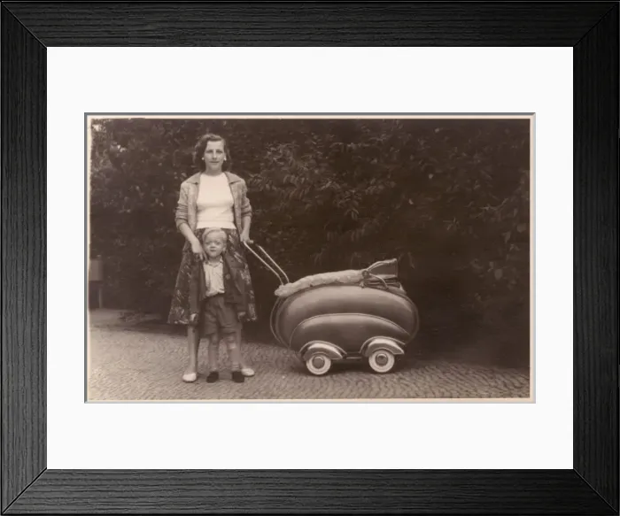 Framed Print : Mother and son with a streamlined Pram Framed Print : Mother and son with a streamlined Pram