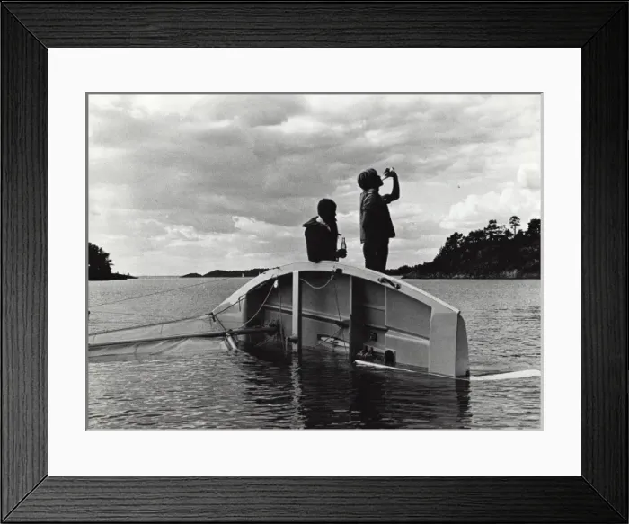 Framed Print : Swedish scouts and upturned sailing boat