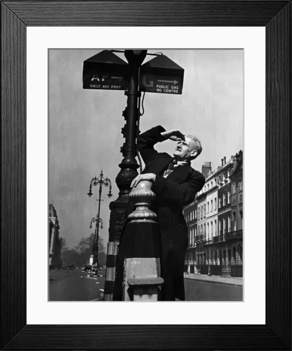 Framed Print : Man examining street signs Framed Print : Man examining street signs