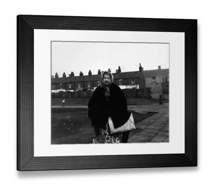 Framed Print : Elderly lady in front of Liverpool housing Framed Print : Elderly lady in front of Liverpool housing