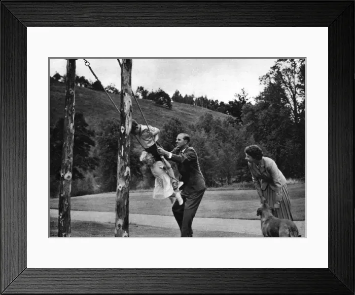 Framed Print : The Queen and Prince Philip play with their children Framed Print : The Queen and Prince Philip play with their children