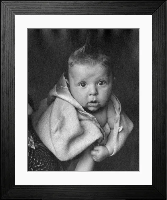 Framed Print : Baby wrapped in a woolly coat Framed Print : Baby wrapped in a woolly coat