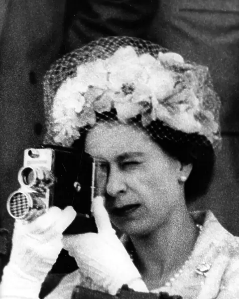 Queen Elizabeth II using a cine camera