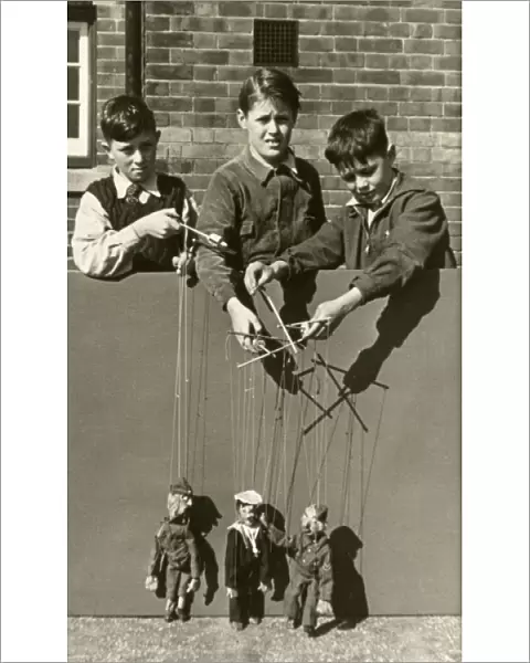 Three Boys playing with Soldier Marionnettes