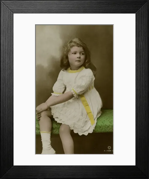 Framed Print : Little girl in white dress with yellow trimmings Framed Print : Little girl in white dress with yellow trimmings