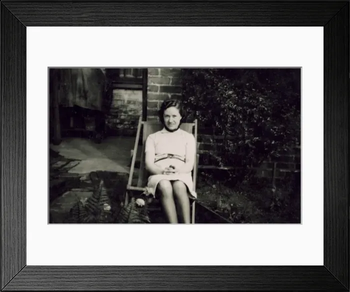 Framed Print : Young woman in deckchair Framed Print : Young woman in deckchair