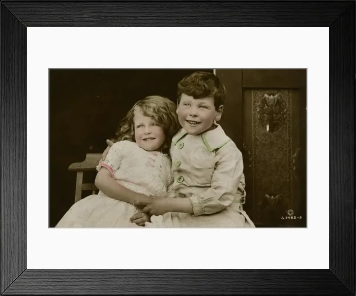Framed Print : Little girl and boy sitting side by side Framed Print : Little girl and boy sitting side by side