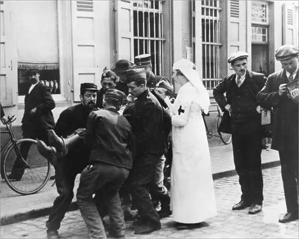 Wounded man in street, Malines, Belgium, WW1